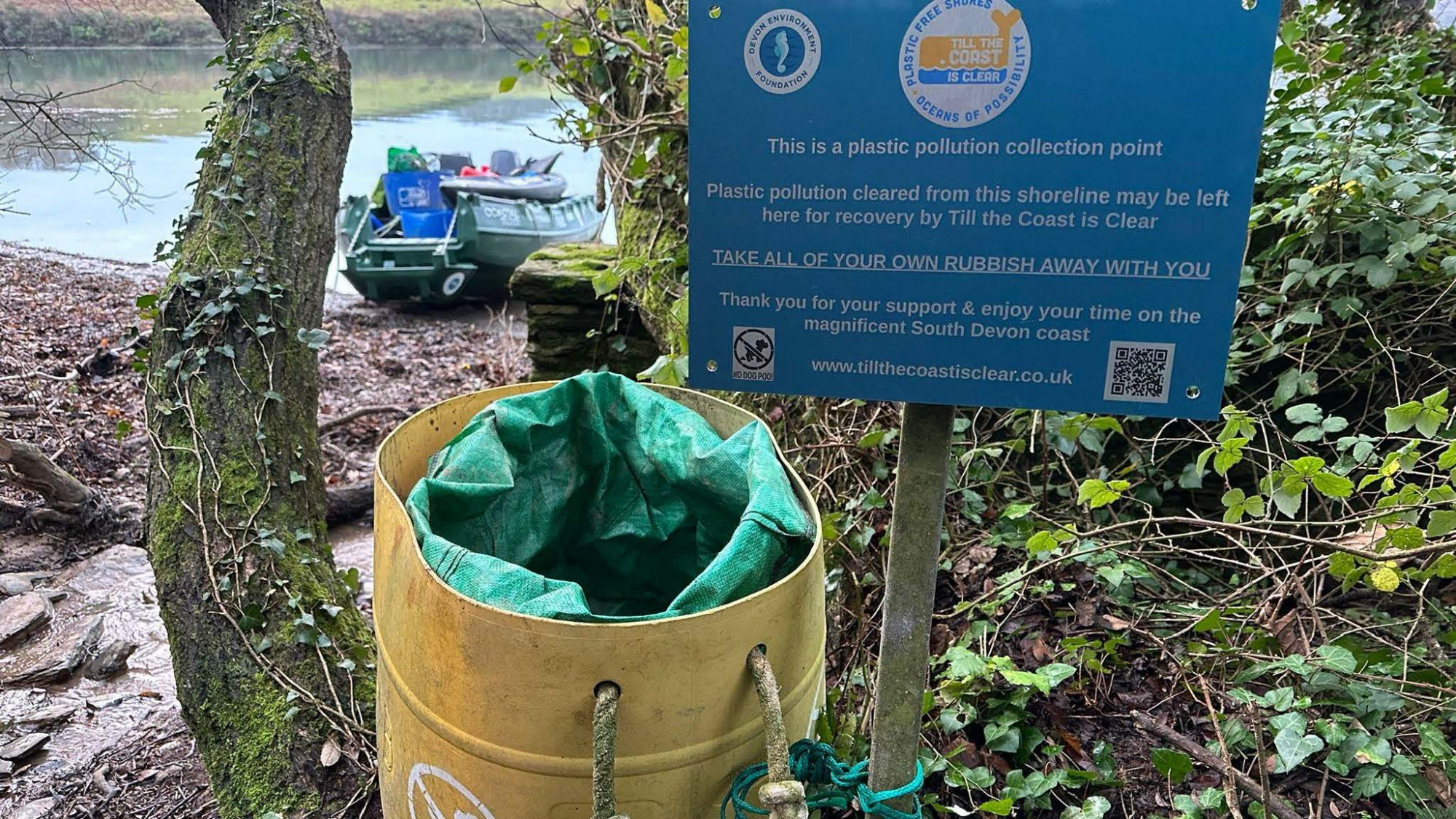 A photo of the existing collection points consisting of upcycled, washed-up oil drums and text-heavy signage.