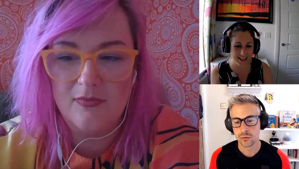 A screenshot of a Mima zoom call between two white women, Emily and Lisa, and one white man, Ollie. Emily is on the larger, speaker view and has pink hair and sits in front of orange patterned wallpaper. All three team members are in concentrated conversation.